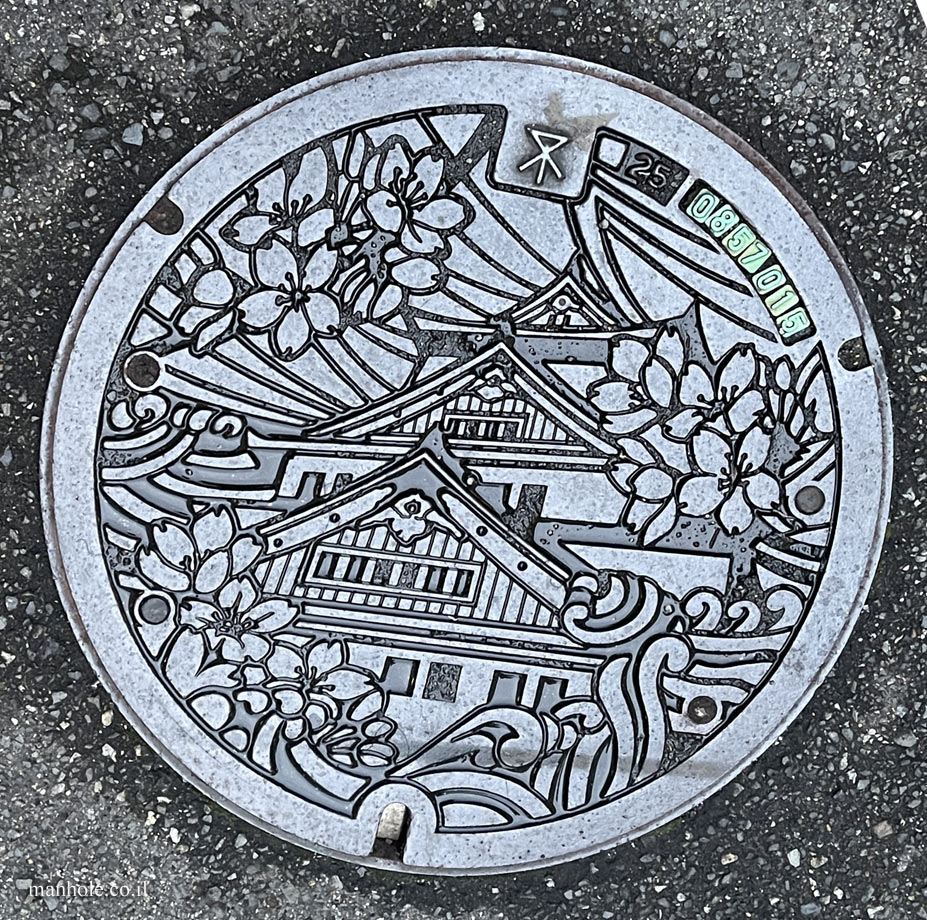 Osaka - a lid with a painting of Osaka Castle on it