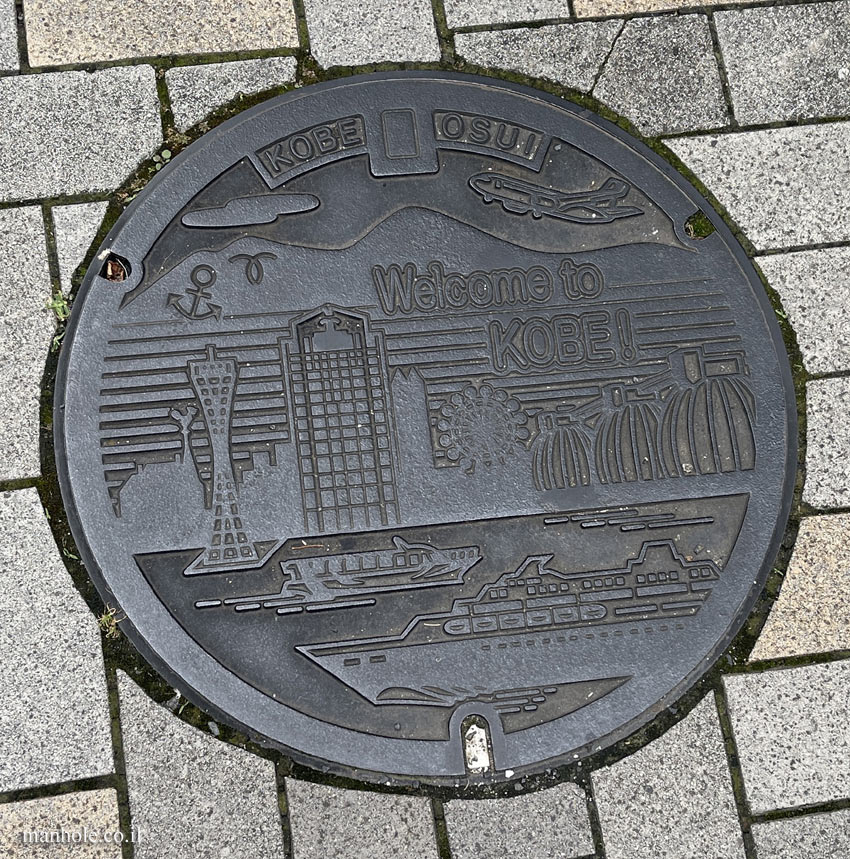 Kobe - sewer - covers and on it well-known buildings in the city
