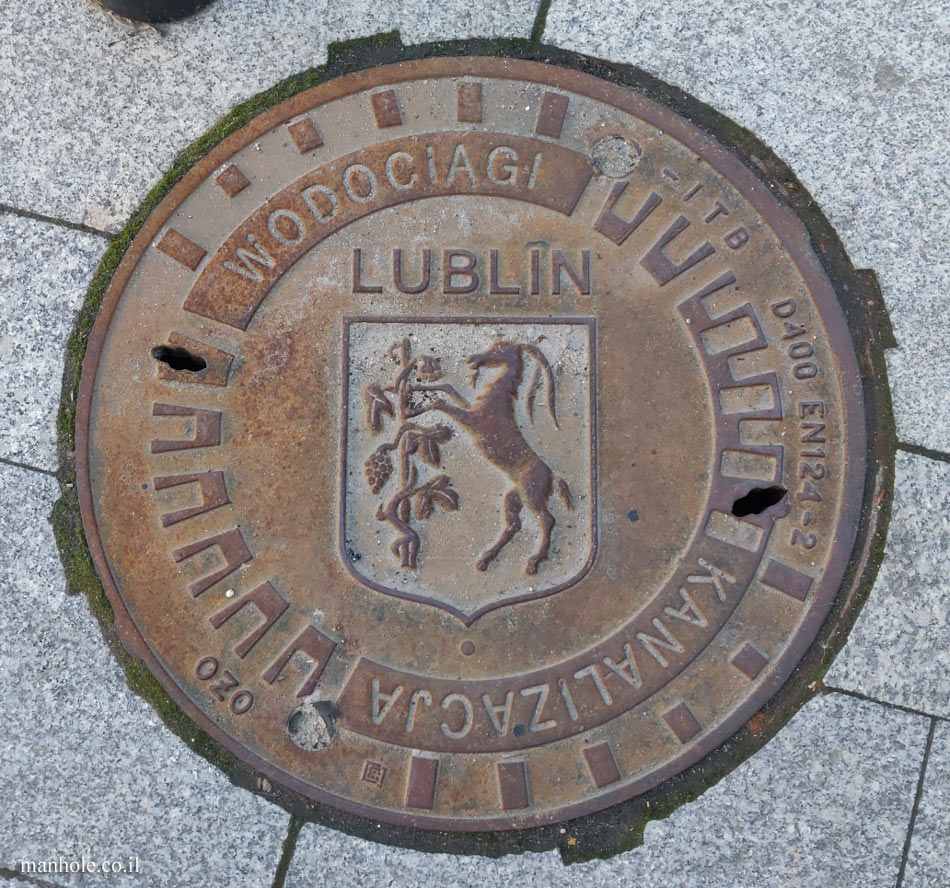 Lublin - sewer cover with the city emblem on it