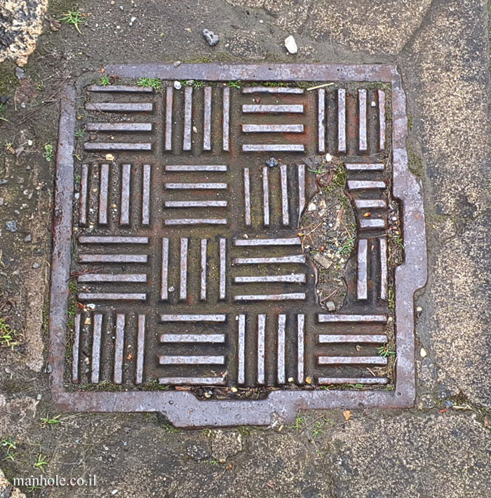 Bath - a cover with a background of squares composed of parallel lines