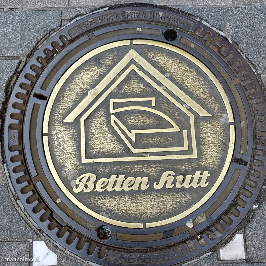 Dortmund - Golden lid with the emblem of the old bedding store Betten Hutt