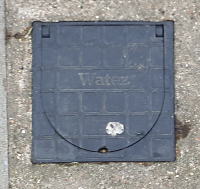 London - A small water cover with two axes