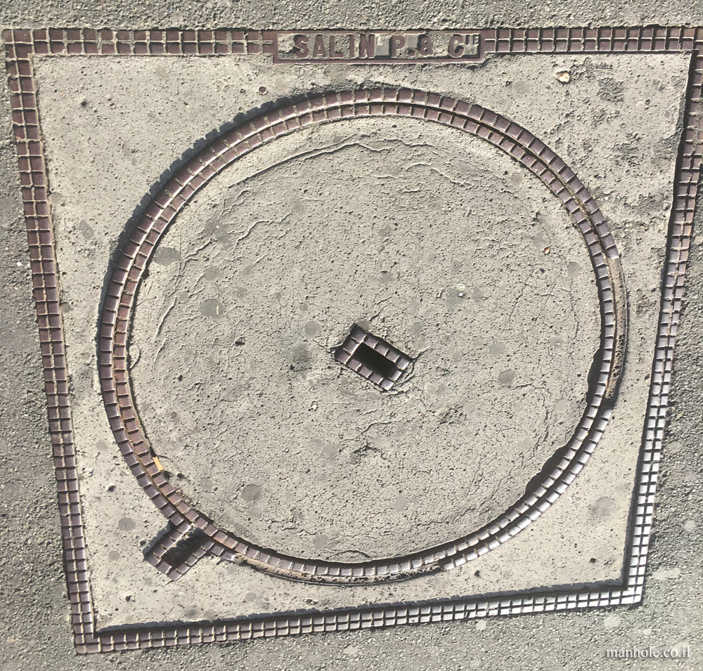 Paris - A round concrete cover in a square frame