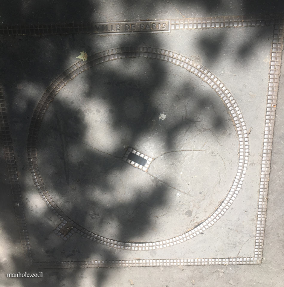 Paris - Montparnasse - A round concrete cover in a square frame