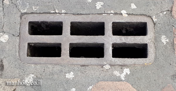 London - Covent Garden - a drainage cover with 6 openings