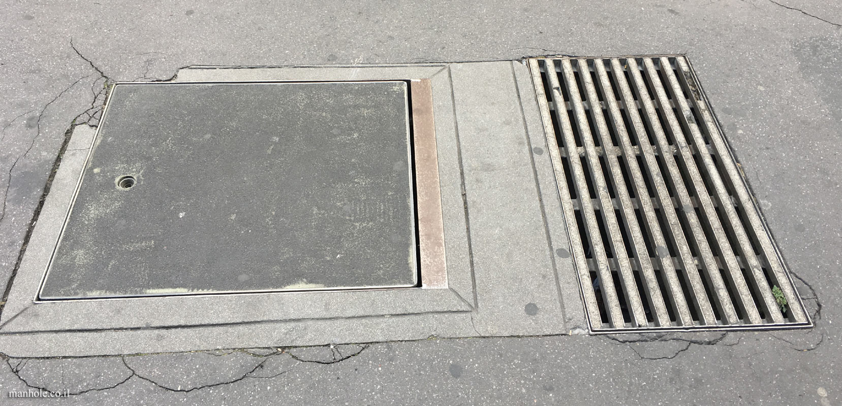 Paris - Concrete cover with a lifting hole and a drainage opening next to it