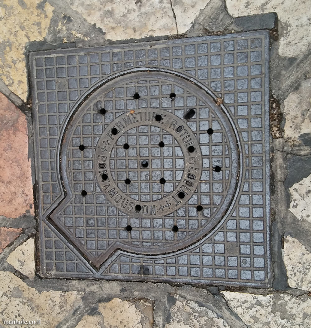 Jerusalem - The Christian Quarter - A circular lid with a handle enclosed in a square frame