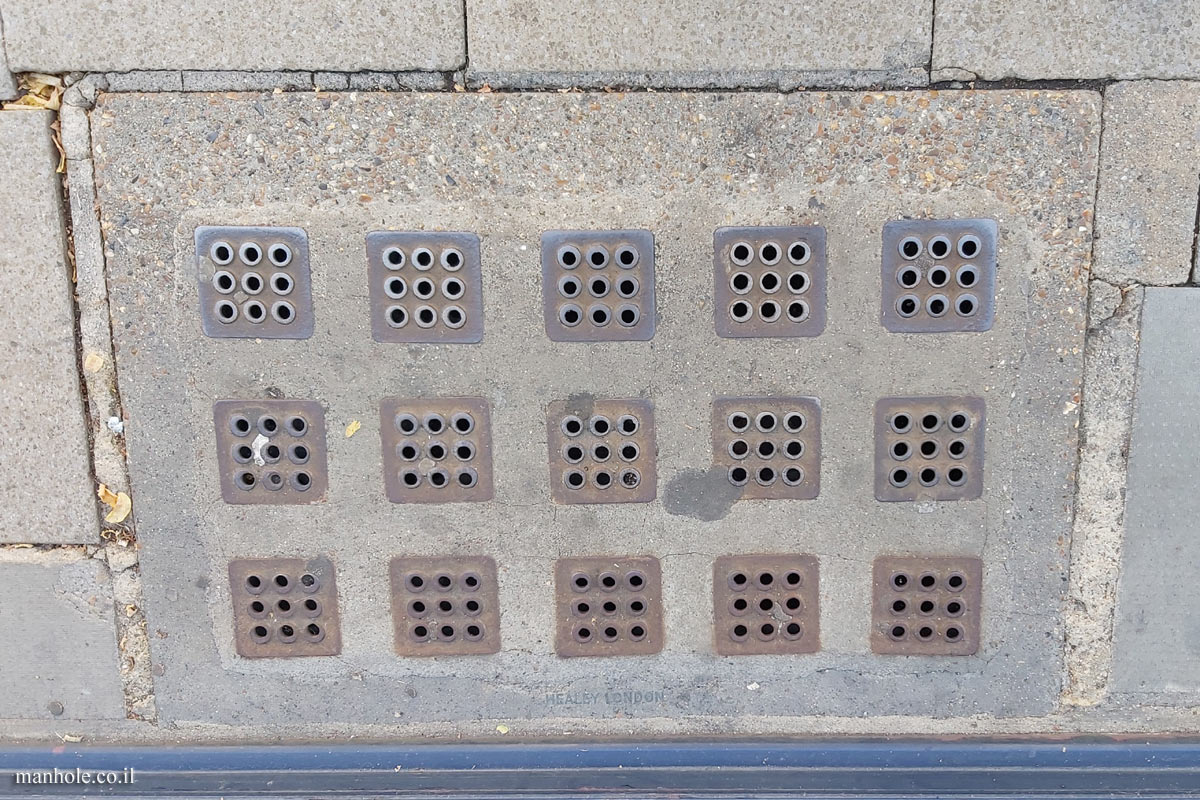 Oxford - a concrete lid with metal squares with holes
