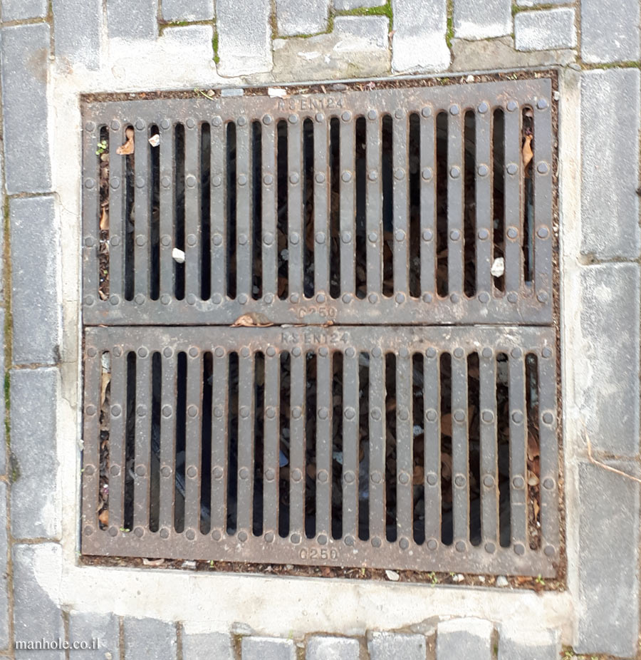 Ramat Gan - Sidewalk drain with prominent points on the metal strips