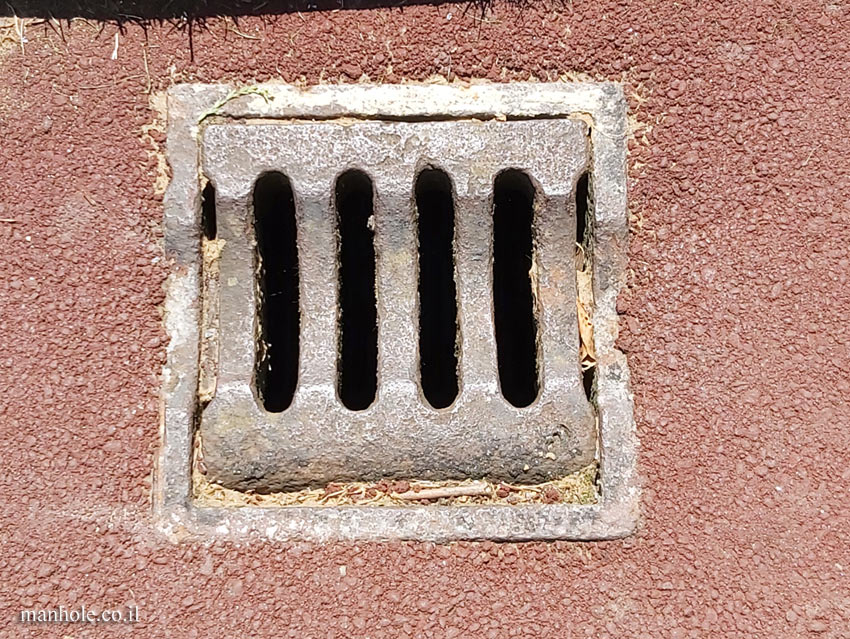 London - Drain - a small lid with vertical grooves