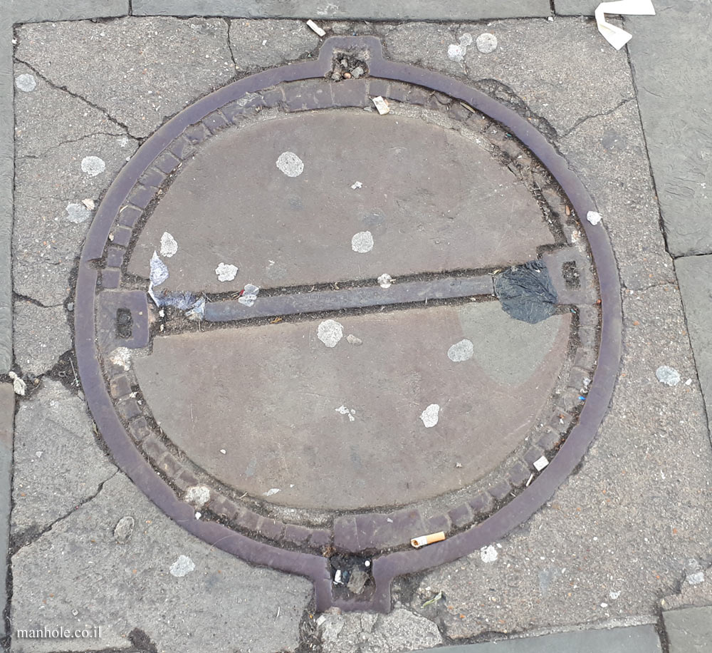 London - Camden Town - A concrete cover with a metal strip in the center