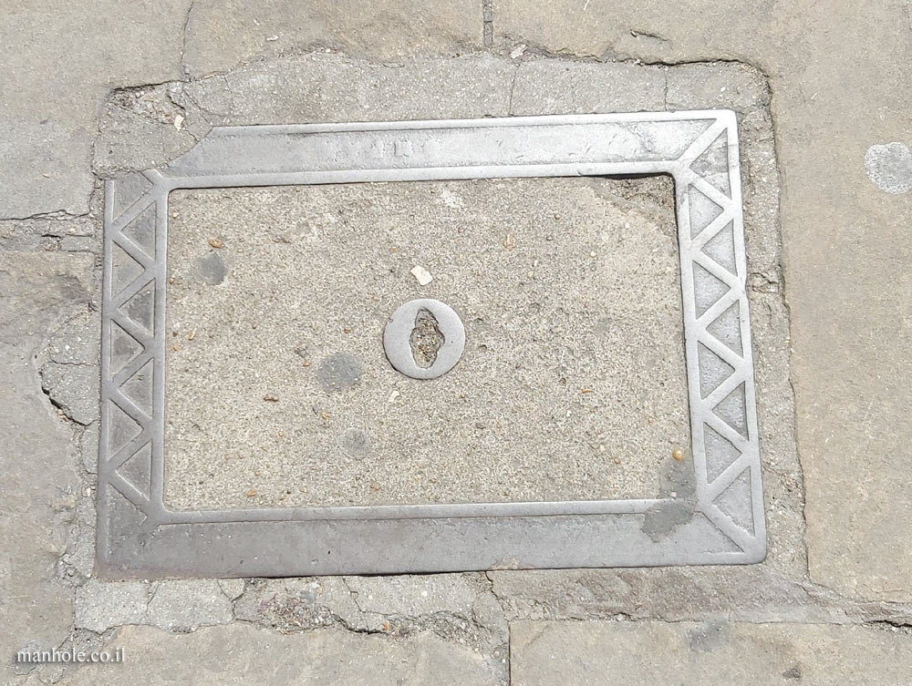 London - A concrete lid with a wide frame with triangles on it