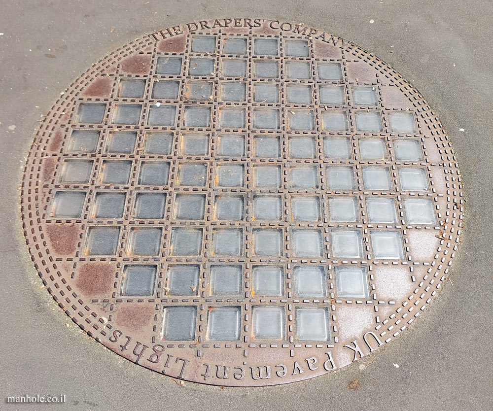 London - a large round lid with transparent squares