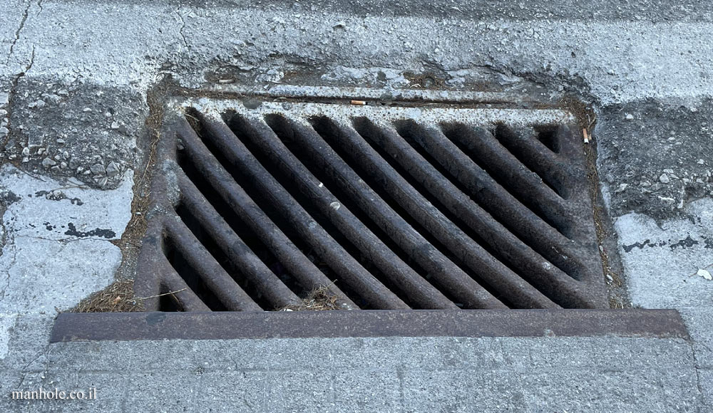Ialisos (Rhodes) - sidewalk drainage with diagonal grooves