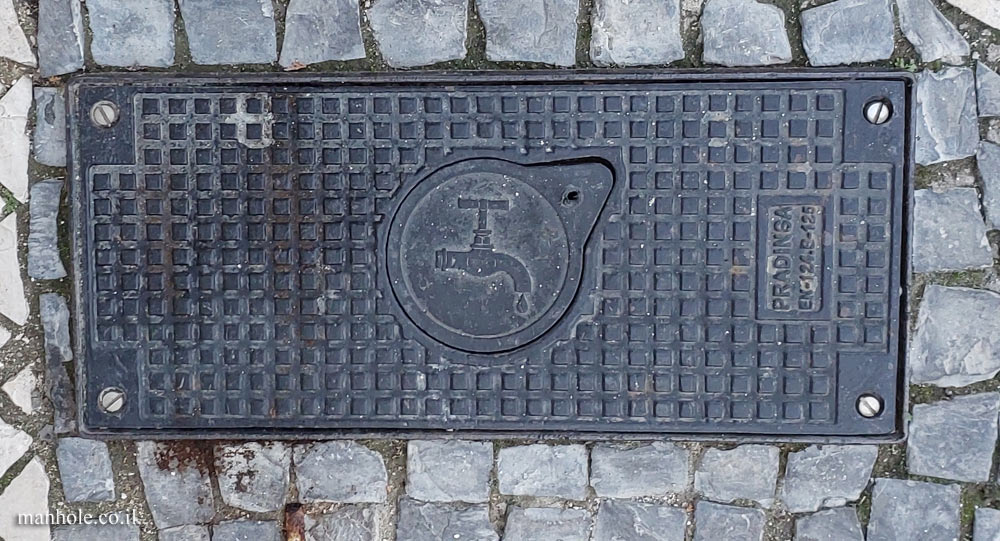 Lisbon - a water cover with an opening on which is an illustration of a water faucet