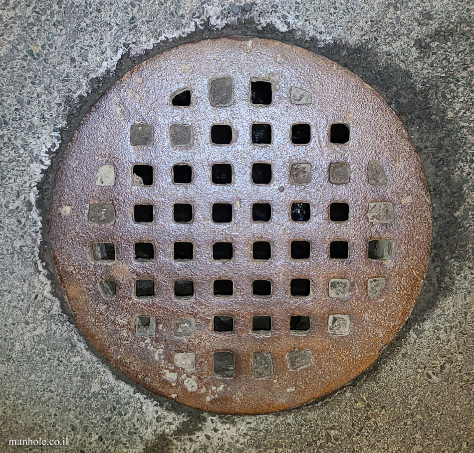 St. John’s, NL - Round drain cover with a matrix of grooves
