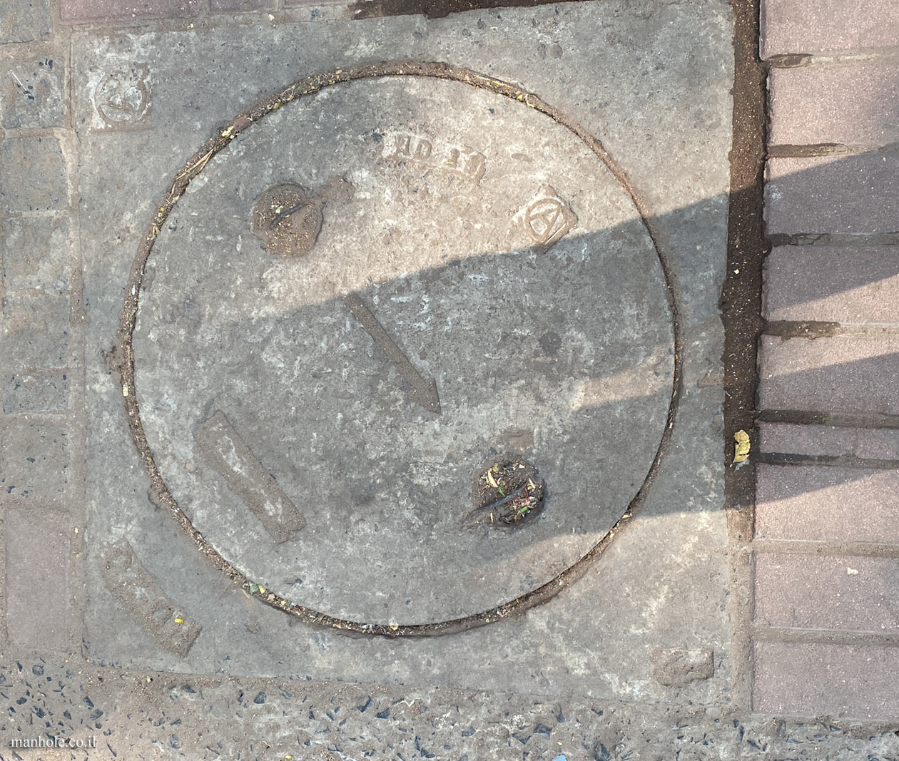 Ahmedabad - A concrete cap with an arrow mark in the center