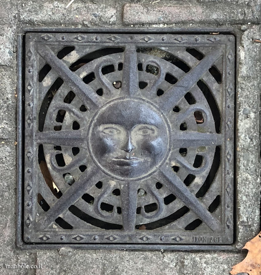 Carnation, WA - A drain cover designed with a smiling sun in the center