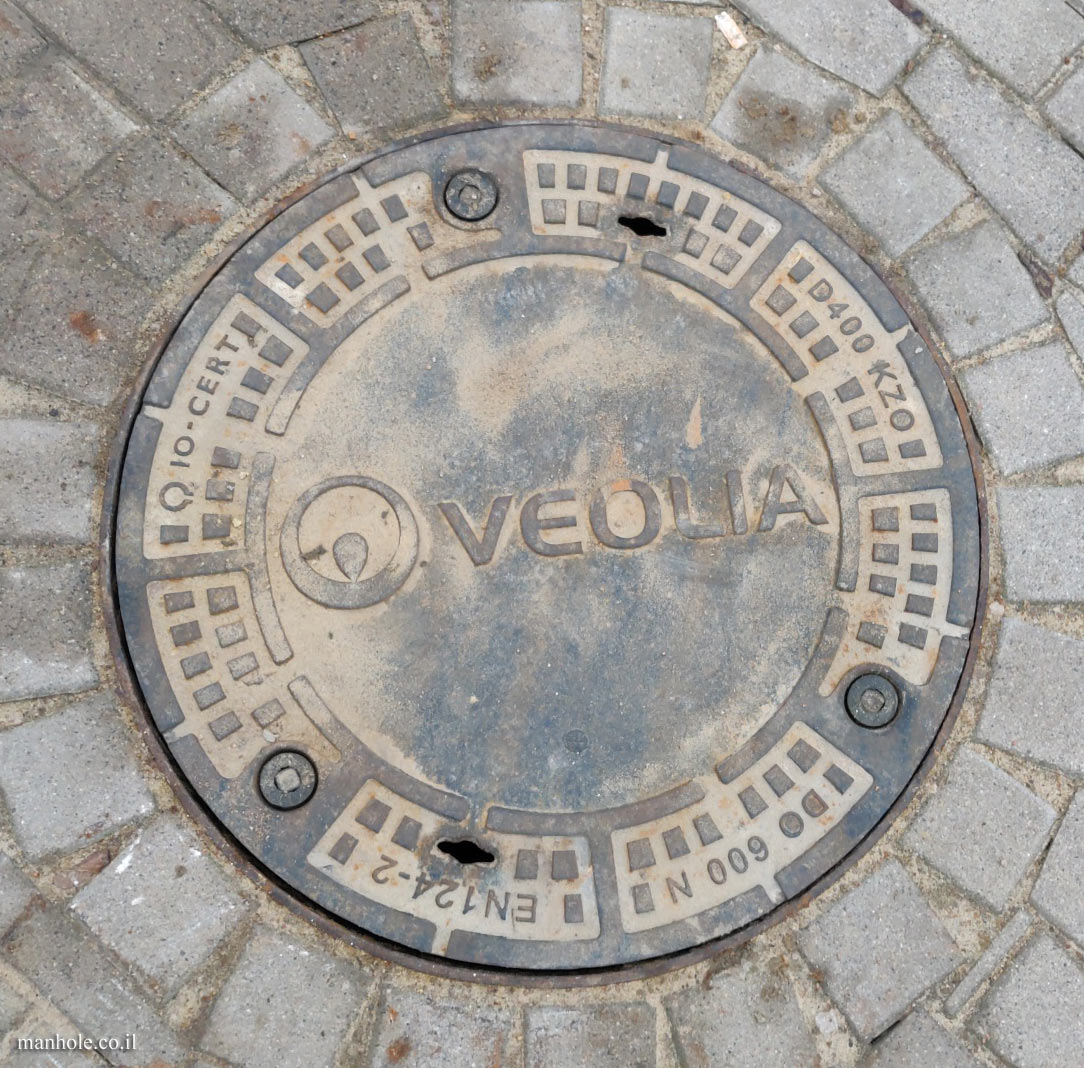 Warsaw - a manhole cover intended for the infrastructure company Veolia