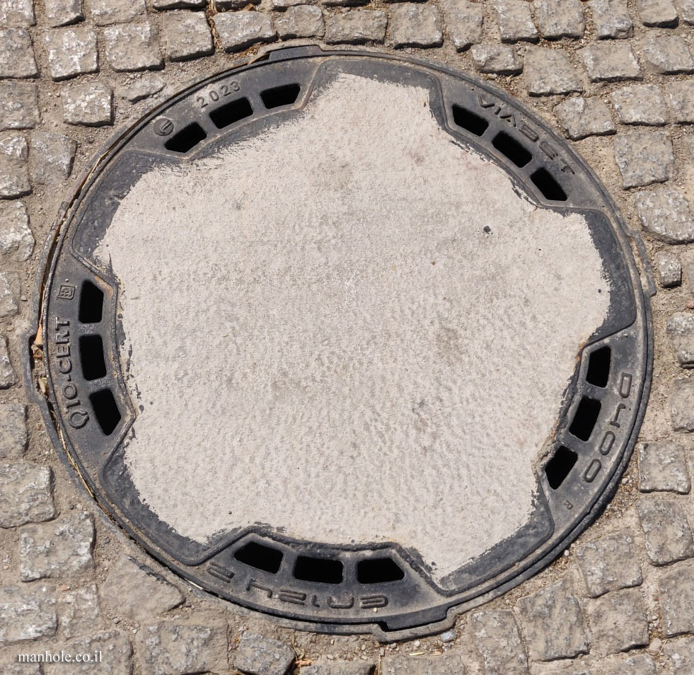 Warsaw - a lid that is partially covered with concrete (3)