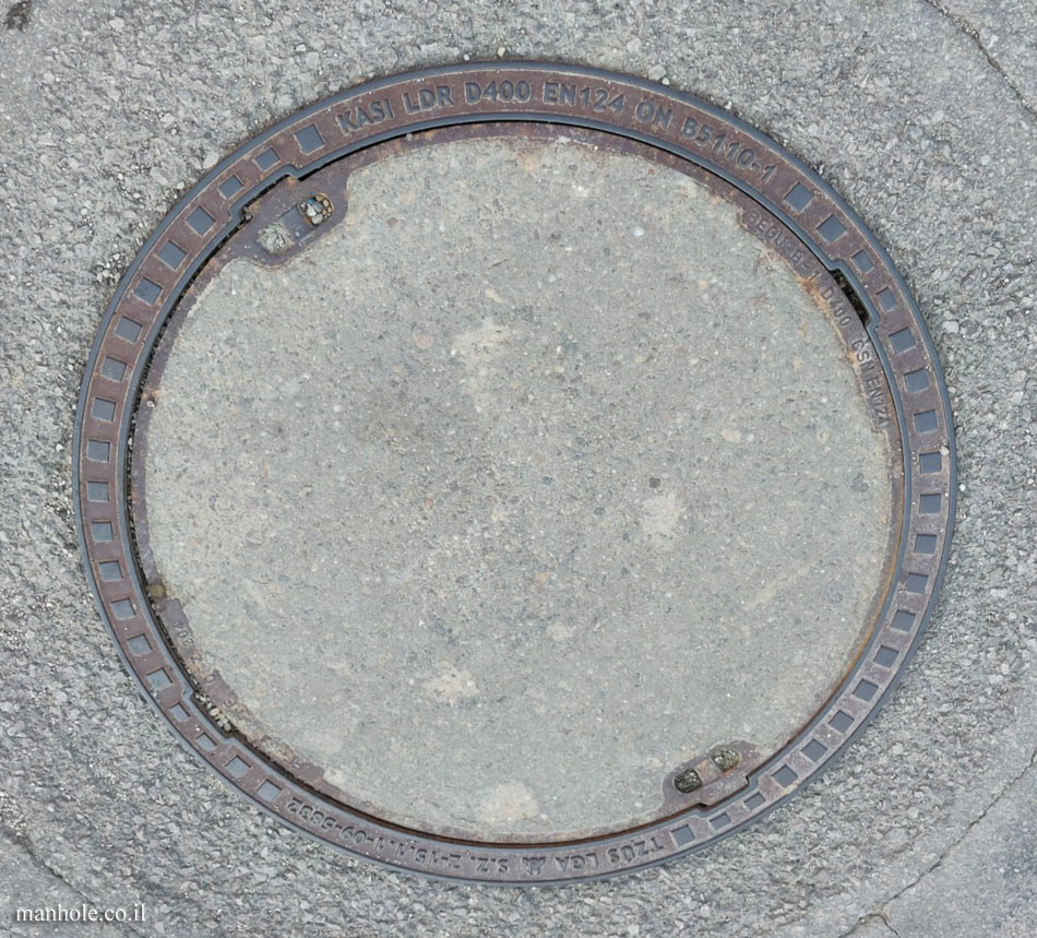 Liptovská Štiavnica - a round concrete cover surrounded by a metal frame