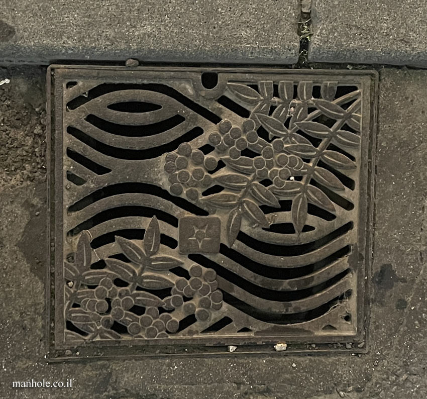 Asahikawa - drain cover designed in the shape of the plant that symbolizes the city